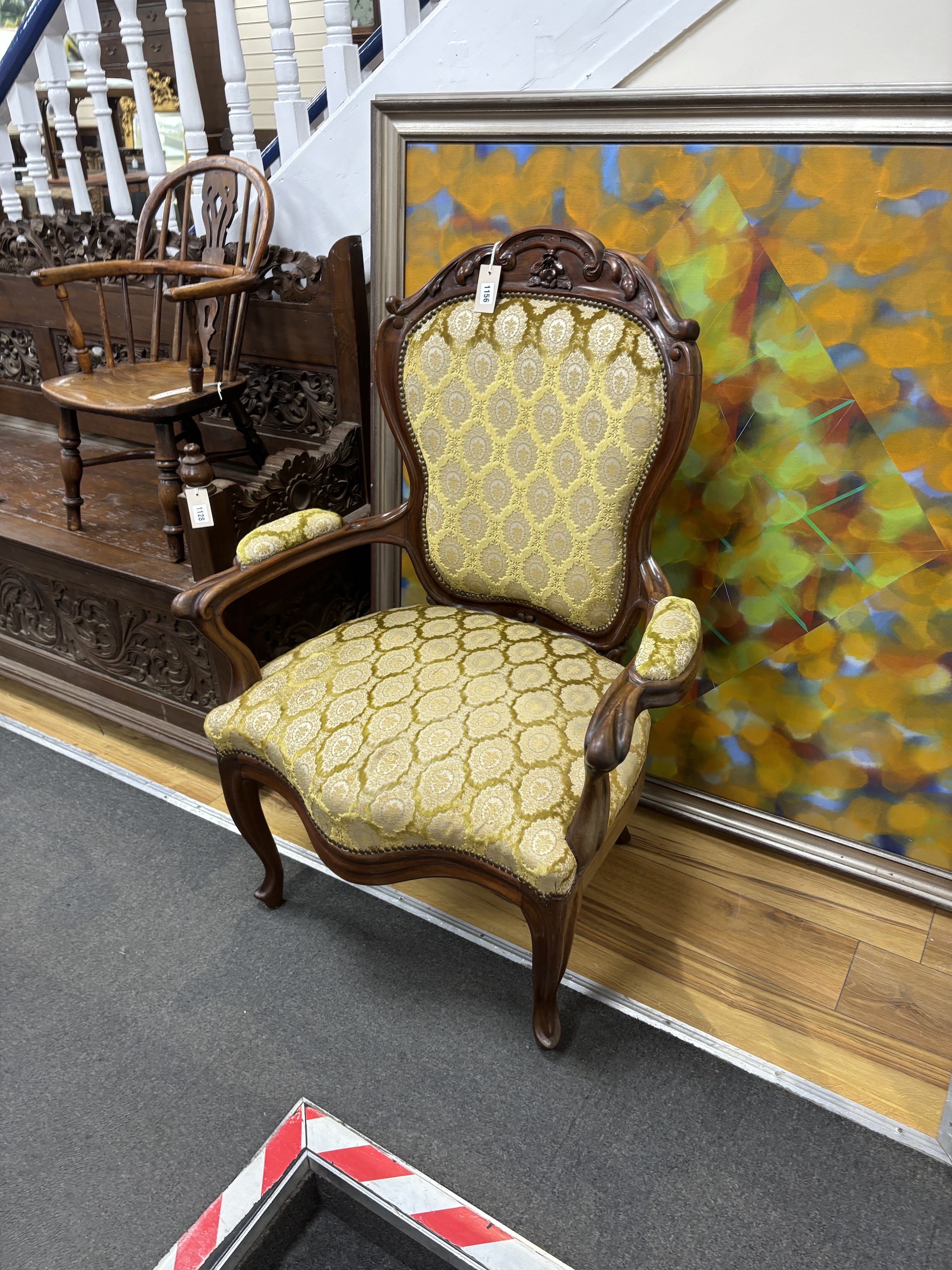 A mid 19th century Dutch mahogany upholstered open armchair, width 75cm, depth 54cm, height 105cm